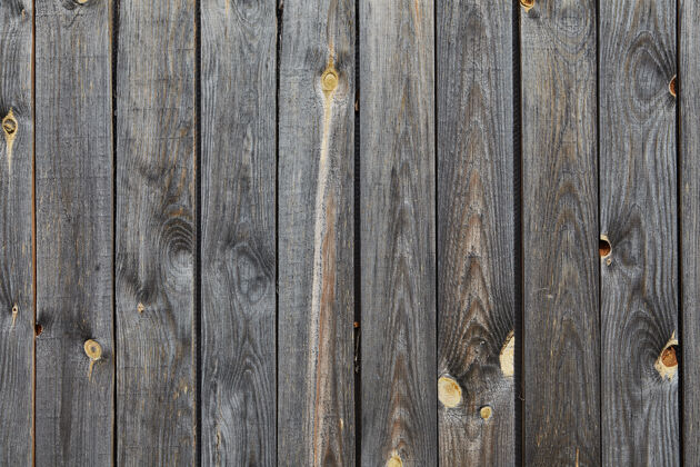 老化一个旧谷仓的木质墙壁纹理由褪色和风化的灰色松木板制成 表面打结 抽象表面斑点木板路