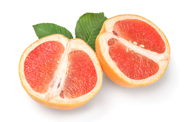 柑橘两个半熟葡萄柚分开放在白纸上食物水果成熟