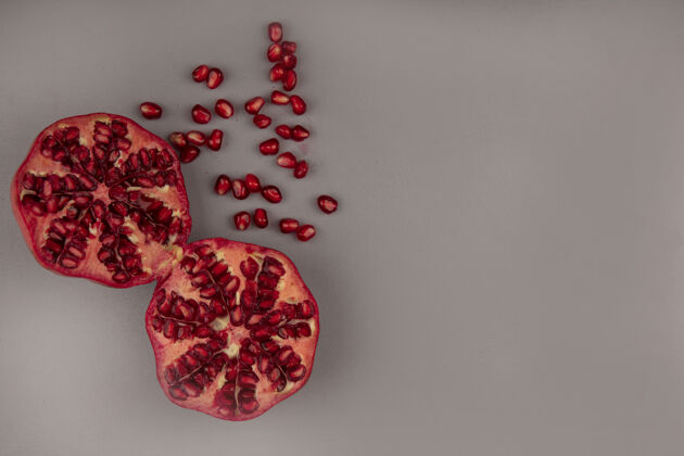 红色新鲜的红石榴种子与复制空间隔离俯视图水果石榴健康