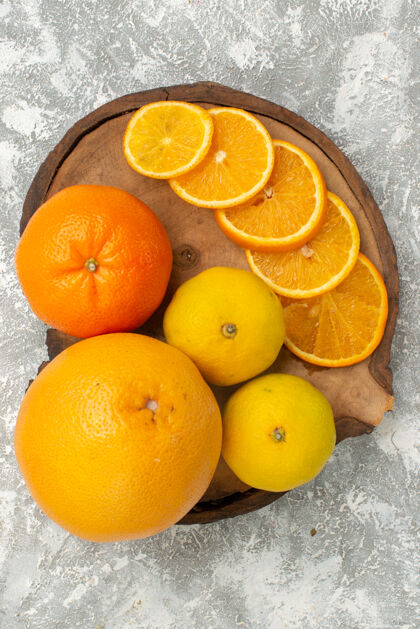 顶部顶视新鲜橘子与橘子在白色表面柑橘异国情调的热带新鲜水果多汁的热带柑橘