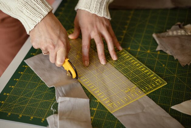 服装特写裁缝手与针工作服装工作场所细节