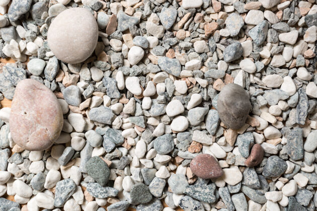 墙纸宏观纹理的五颜六色的卵石躺在海边河流表面海岸