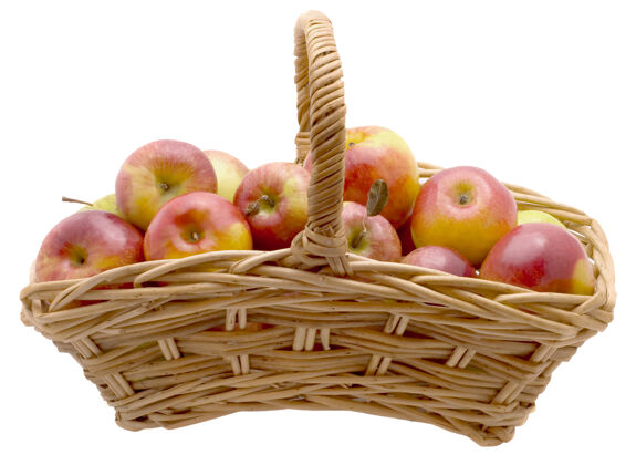 素食成熟的红苹果放在篮子里 在白色的背景上隔离开来提神自然成熟