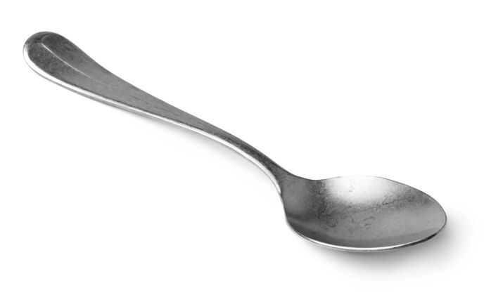勺子银汤匙隔离在白墙上特写 餐具工具设备钢