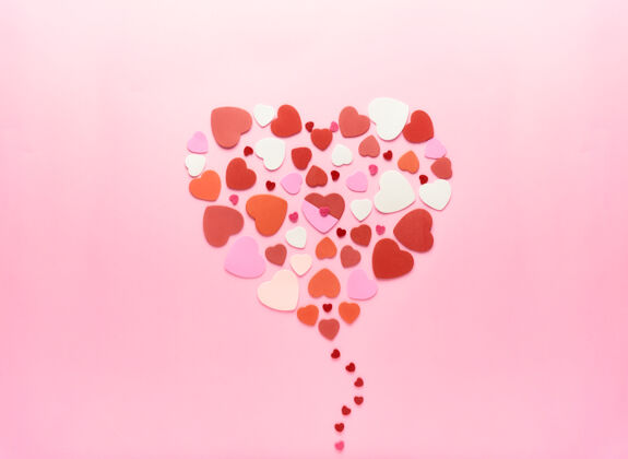 纸情人节用粉色背景的红心做成的甜心心情人节情人节