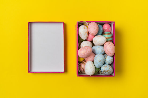 手工制作黄色带复活节彩蛋的长方形盒子顶视图背景多色节日彩蛋长方形庆祝复活节