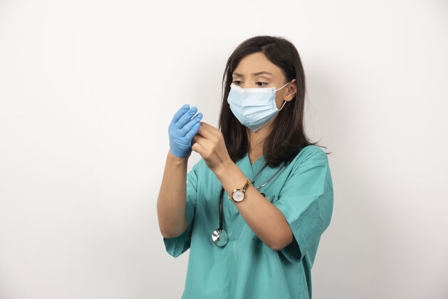 工人戴着医用口罩的女医生戴着白底手套高质量照片职业制服听诊器