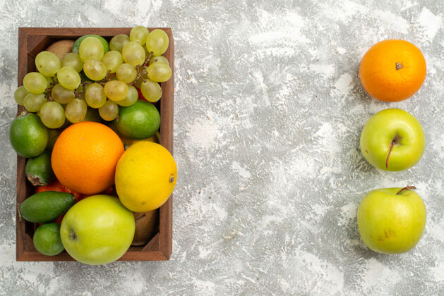 葡萄顶视新鲜葡萄 配上飞珠苹果和橘子 背景水果醇厚成熟新鲜的异国柑橘新鲜醇香菲乔