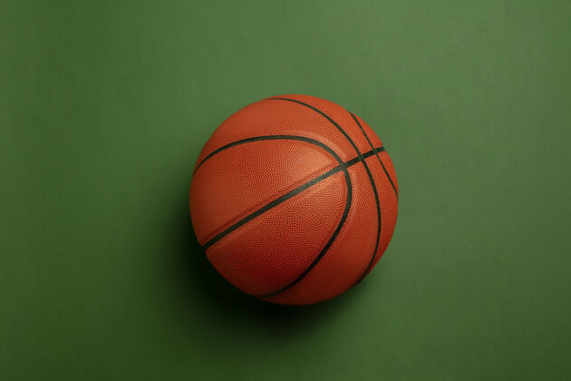 健康明亮的橙色布劳恩篮球专业运动设备隔离在绿色背景上网球游戏射击