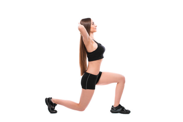 健康运动型健康女性的肖像 穿着运动服锻炼身体 在白色背景上单独做运动活动女性女人