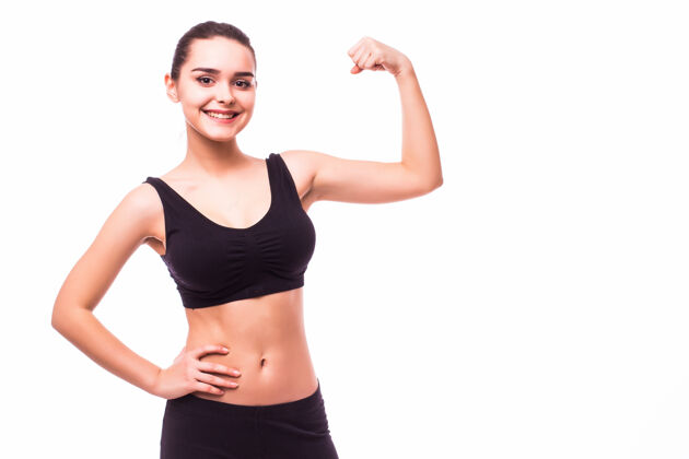 运动运动与完美的身体显示肱二头肌 健身女孩工作室拍摄白色背景的年轻女子成人女性肌肉