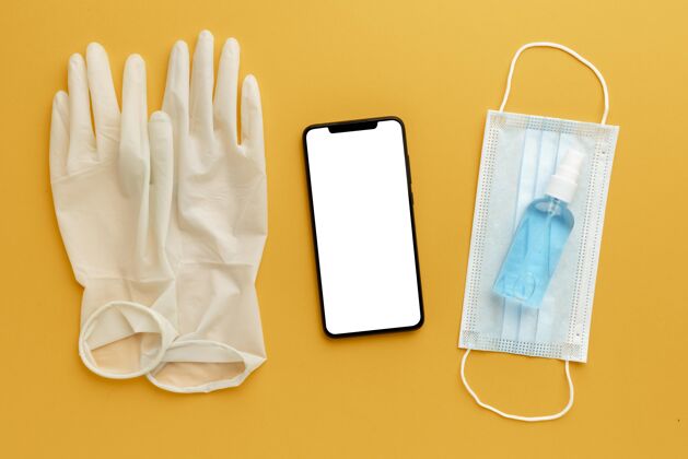 面罩带智能手机和洗手液的扁平手套冠状病毒医疗感染